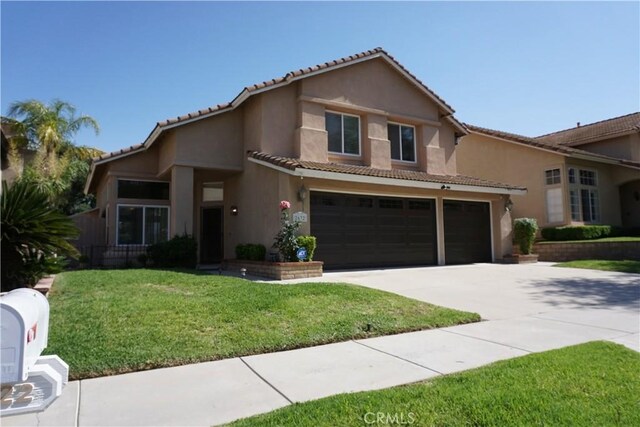 2622 Presidio Ln, Corona, CA 92879 - view of front of home with an attached garage, a tiled roof, driveway, stucco siding, and a front yard
