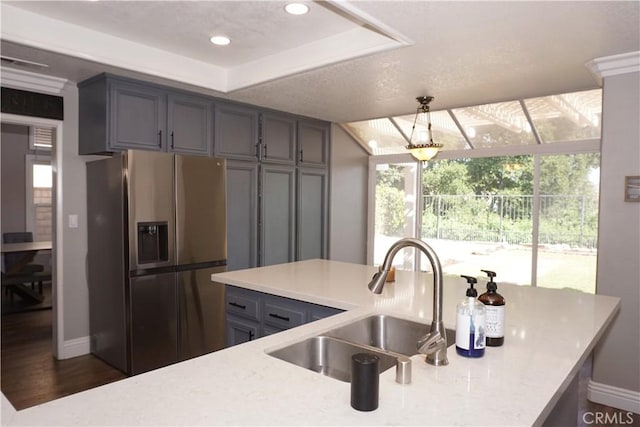 2622 Presidio Ln, Corona, CA 92879 - kitchen with stainless steel fridge, a raised ceiling, pendant lighting, gray cabinets, and recessed lighting