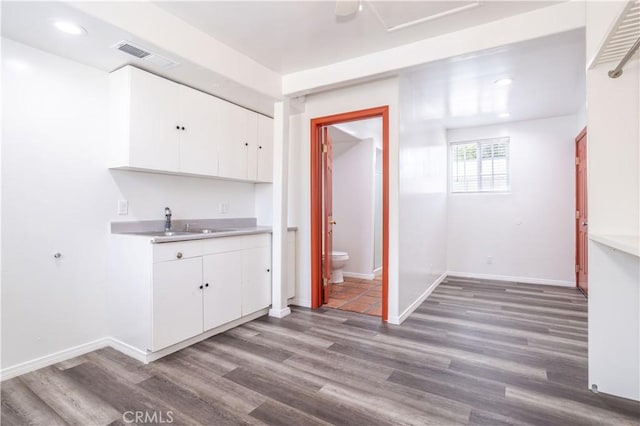 7343 Owensmouth Ave, Canoga Park, CA 91303 - bar area with wood finished floors, a sink, baseboards, and recessed lighting