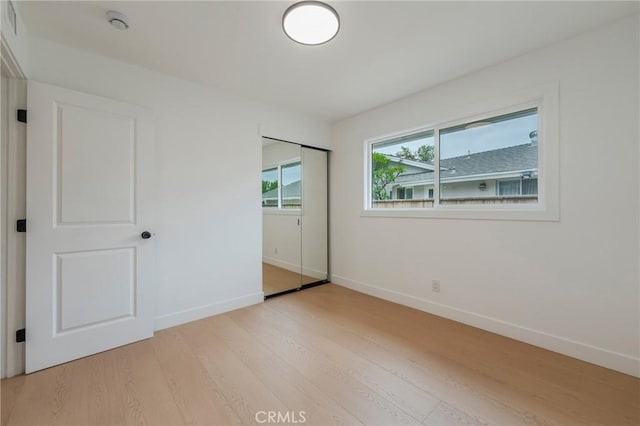 1304 Walling Ave, Brea, CA 92821 - unfurnished bedroom with light wood-style floors, baseboards, and a closet