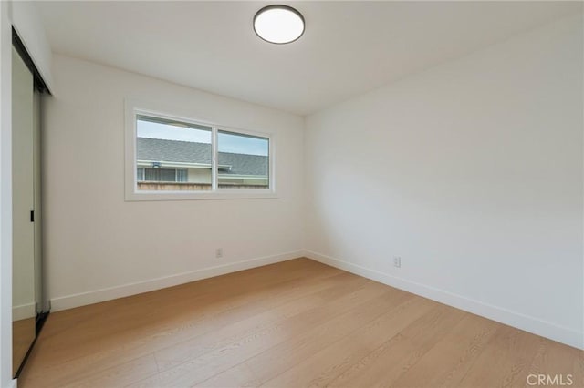 1304 Walling Ave, Brea, CA 92821 - unfurnished bedroom featuring light wood finished floors, baseboards, and a closet