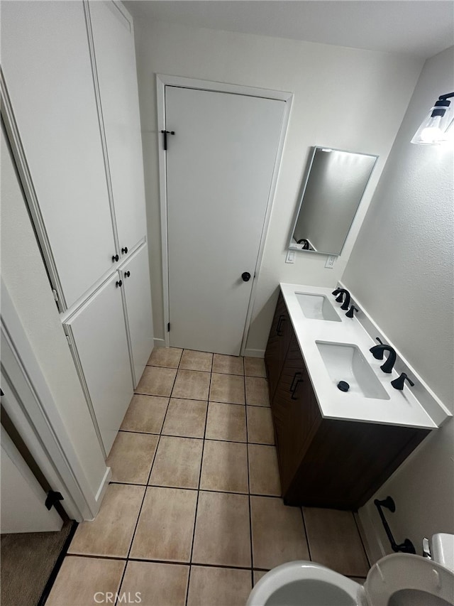 10309 Bodger St Unit 14, El Monte, CA 91733 - bathroom with tile patterned floors, double vanity, and toilet