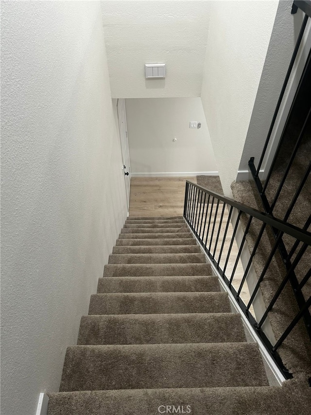 10309 Bodger St Unit 14, El Monte, CA 91733 - stairs with a textured wall, wood finished floors, and baseboards