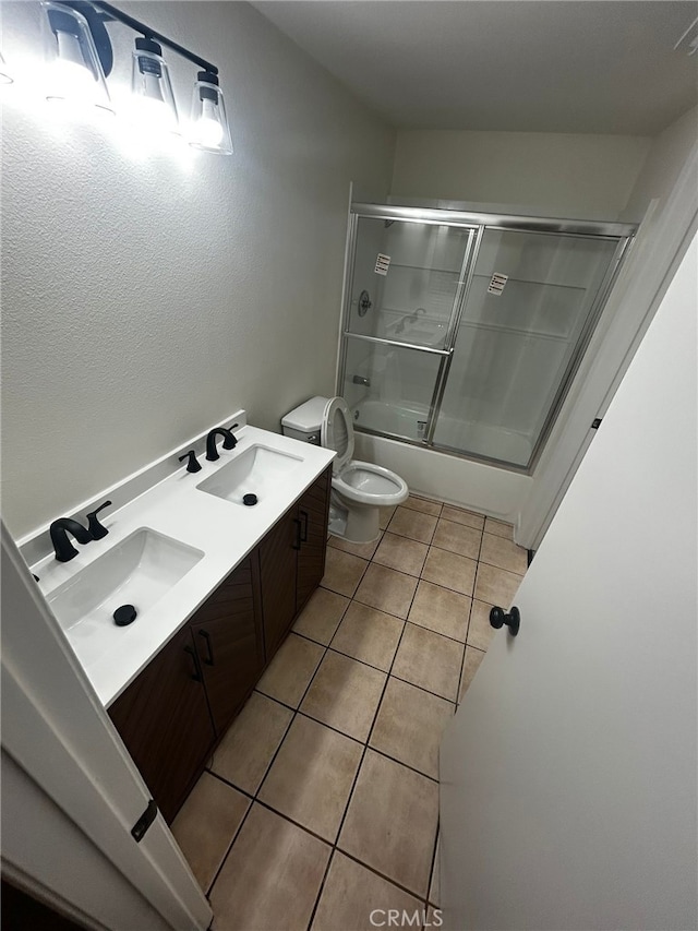 10309 Bodger St Unit 14, El Monte, CA 91733 - bathroom featuring toilet, tile patterned floors, shower / bath combination with glass door, and double vanity
