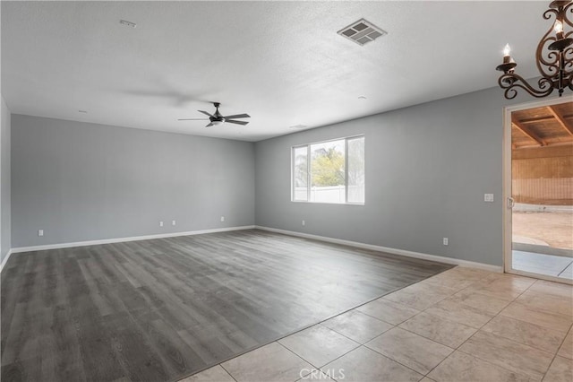 30574 Saddlehorn Way, Menifee, CA 92584 - tiled spare room featuring a ceiling fan and a chandelier