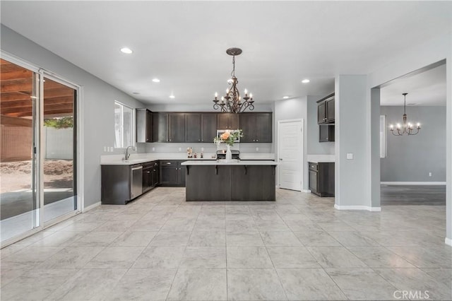 30574 Saddlehorn Way, Menifee, CA 92584 - kitchen with a chandelier, stainless steel appliances, light countertops, a kitchen island, and recessed lighting