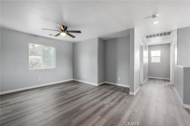 30574 Saddlehorn Way, Menifee, CA 92584 - empty room featuring wood finished floors, ceiling fan, and a textured ceiling