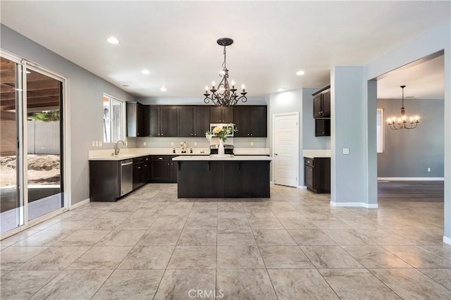 30574 Saddlehorn Way, Menifee, CA 92584 - kitchen featuring a chandelier, appliances with stainless steel finishes, light countertops, a center island, and recessed lighting