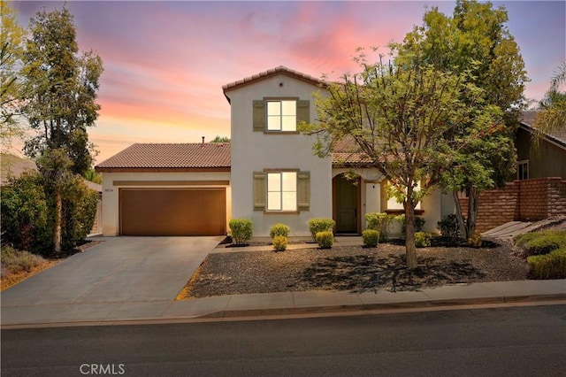 30574 Saddlehorn Way, Menifee, CA 92584 - mediterranean / spanish house featuring a tile roof, stucco siding, driveway, and a garage