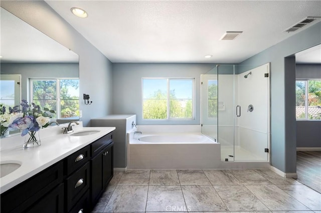 30574 Saddlehorn Way, Menifee, CA 92584 - full bath with a bath, double vanity, and a shower stall
