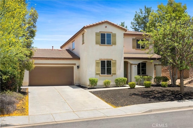 30574 Saddlehorn Way, Menifee, CA 92584 - mediterranean / spanish house featuring a tiled roof, a garage, stucco siding, and driveway