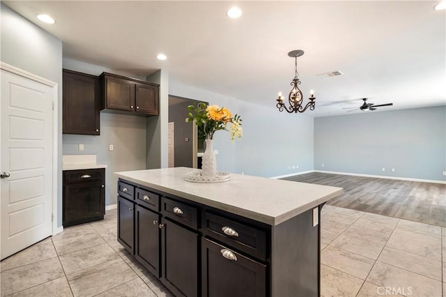 30574 Saddlehorn Way, Menifee, CA 92584 - kitchen featuring light countertops, ceiling fan, decorative light fixtures, light tile patterned flooring, and recessed lighting
