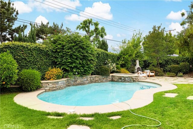 221 Grand Oaks Dr, Glendora, CA 91741 - view of swimming pool featuring a lawn, a pool with connected hot tub, and a patio