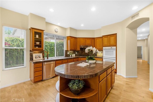 221 Grand Oaks Dr, Glendora, CA 91741 - kitchen featuring open shelves, stainless steel dishwasher, tile counters, white double oven, and a sink