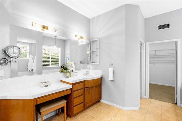 221 Grand Oaks Dr, Glendora, CA 91741 - full bath with double vanity, a walk in closet, baseboards, and tile patterned flooring