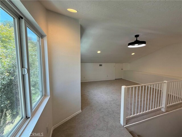 10328 Shoshone Ave, Riverside, CA 92503 - hallway with carpet floors, baseboards, recessed lighting, and a textured ceiling