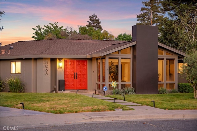 3066 Claret Cir, Atwater, CA 95301 - mid-century inspired home featuring a front lawn and a chimney