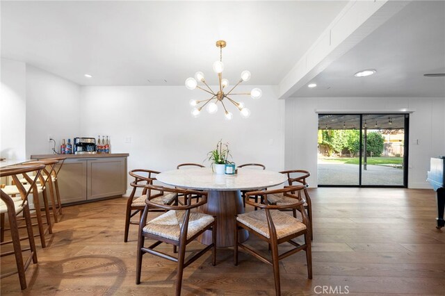 3066 Claret Cir, Atwater, CA 95301 - dining room featuring a chandelier, light wood-style flooring, and recessed lighting