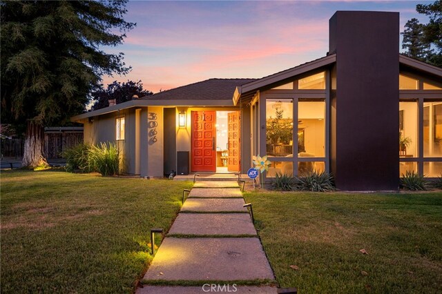 3066 Claret Cir, Atwater, CA 95301 - mid-century home with a chimney and stucco siding