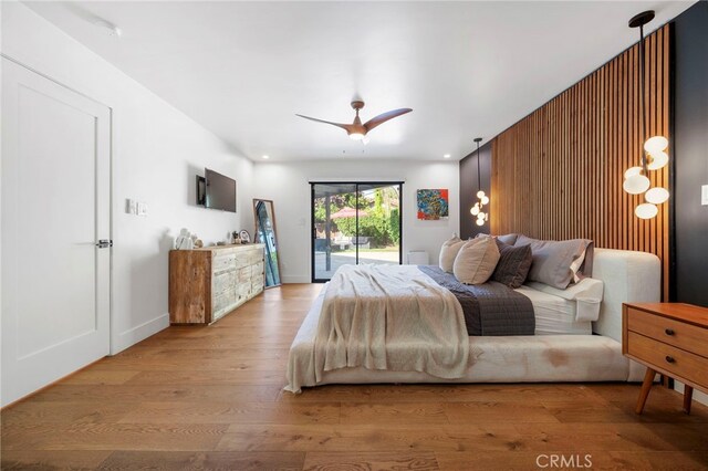 3066 Claret Cir, Atwater, CA 95301 - bedroom featuring access to exterior, wood finished floors, and a ceiling fan