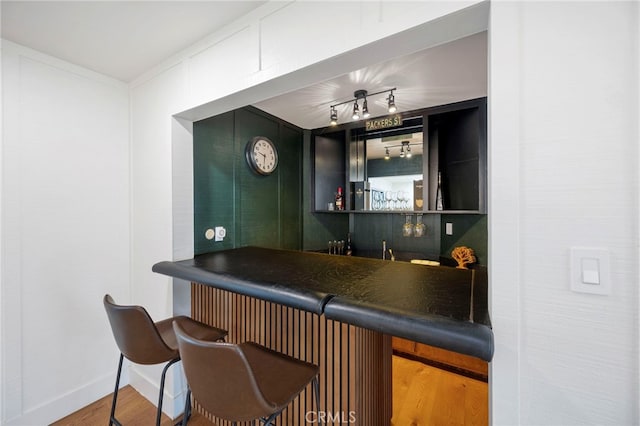 3066 Claret Cir, Atwater, CA 95301 - indoor wet bar featuring wood finished floors and baseboards