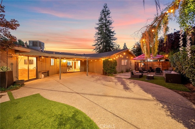 3066 Claret Cir, Atwater, CA 95301 - view of front of house featuring a patio area, central AC, and an outdoor living space
