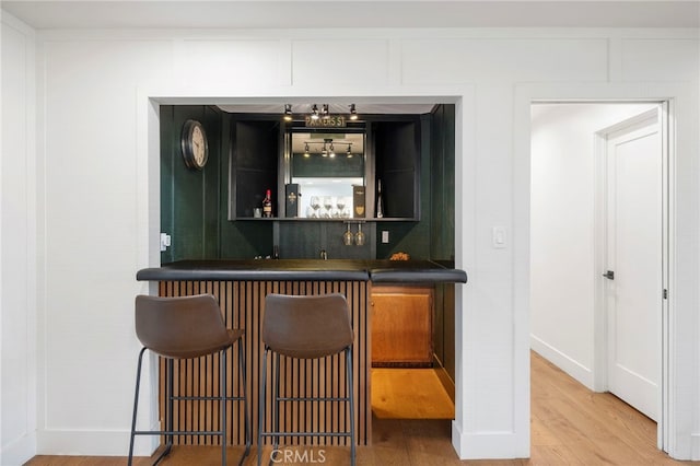 3066 Claret Cir, Atwater, CA 95301 - indoor wet bar with wood finished floors and baseboards