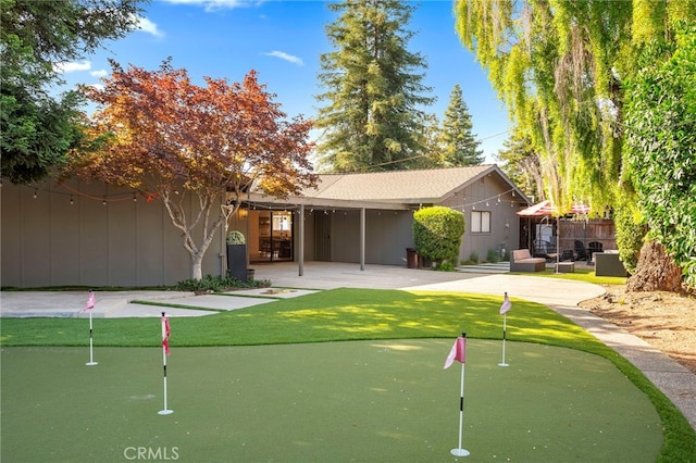 3066 Claret Cir, Atwater, CA 95301 - surrounding community with a putting area and a patio