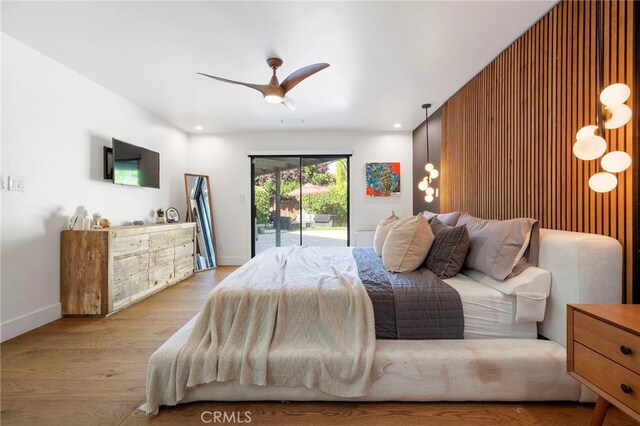 3066 Claret Cir, Atwater, CA 95301 - bedroom featuring access to outside, wood finished floors, baseboards, and ceiling fan