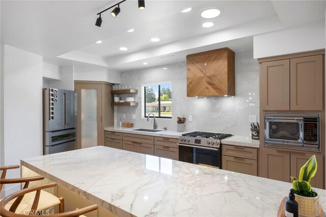 3066 Claret Cir, Atwater, CA 95301 - kitchen with stainless steel appliances, a sink, open shelves, backsplash, and light stone countertops