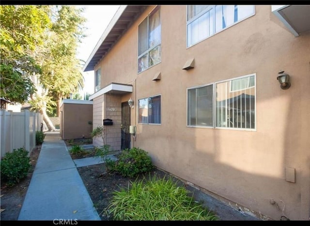 134281/2 Village Dr Unit 1/2, Cerritos, CA 90703 - view of property exterior featuring stucco siding