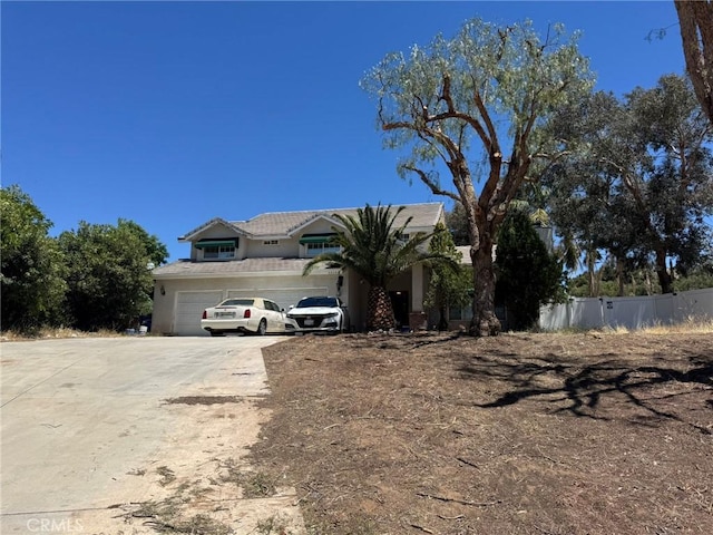 33344 Rose Ave, Acton, CA 93510 - view of front facade with driveway, a tiled roof, stucco siding, and an attached garage
