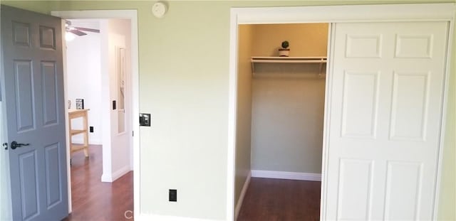 1265 Kendall Dr Unit 1326, San Bernardino, CA 92407 - unfurnished bedroom featuring dark wood-style flooring, baseboards, and a closet