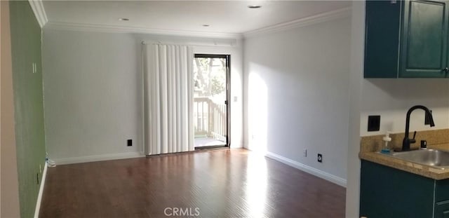 1265 Kendall Dr Unit 1326, San Bernardino, CA 92407 - unfurnished dining area featuring a sink, wood finished floors, baseboards, and crown molding