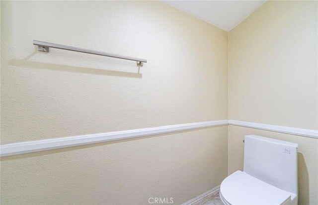 9791 Lee St, Cypress, CA 90630 - bathroom featuring toilet and lofted ceiling