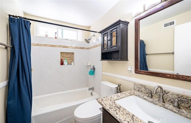 9791 Lee St, Cypress, CA 90630 - bathroom with shower / tub combo with curtain, vanity, and toilet