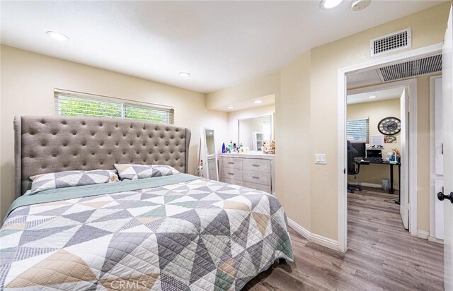 9791 Lee St, Cypress, CA 90630 - bedroom with wood finished floors, a desk, baseboards, and recessed lighting