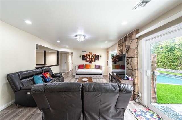 9791 Lee St, Cypress, CA 90630 - living area with light wood-type flooring, baseboards, and recessed lighting