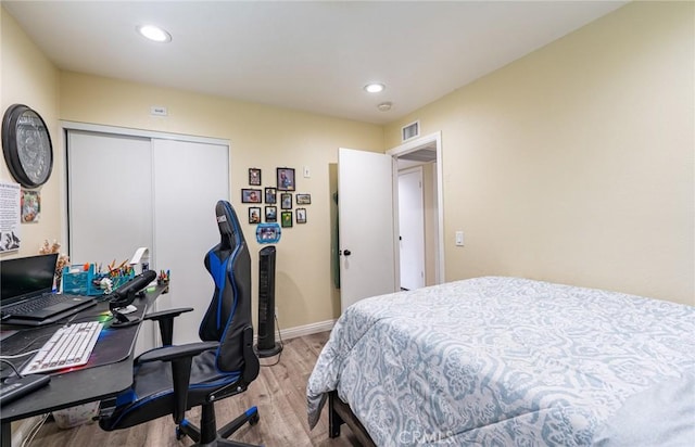 9791 Lee St, Cypress, CA 90630 - bedroom with wood finished floors, recessed lighting, baseboards, a closet, and an office area