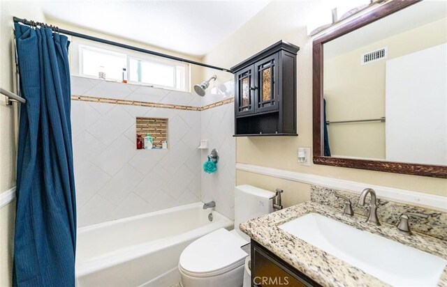 9791 Lee St, Cypress, CA 90630 - bathroom with shower / bathtub combination with curtain, vanity, and toilet