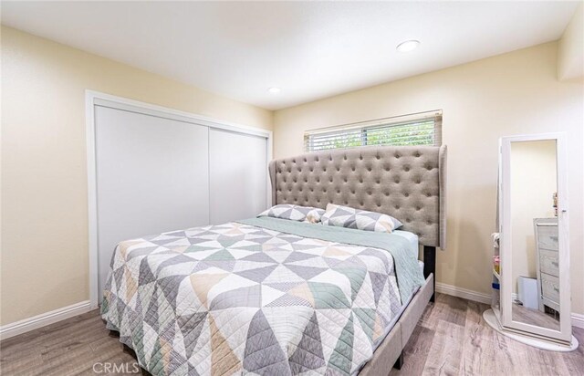 9791 Lee St, Cypress, CA 90630 - bedroom with wood finished floors, a closet, baseboards, and recessed lighting
