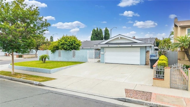 9791 Lee St, Cypress, CA 90630 - ranch-style home featuring a gate, an attached garage, driveway, and stucco siding
