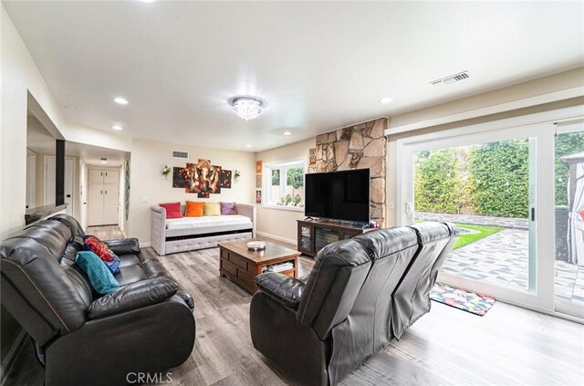 9791 Lee St, Cypress, CA 90630 - living room with wood finished floors, healthy amount of natural light, recessed lighting, and baseboards