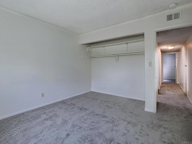 3304 E St, San Diego, CA 92102 - unfurnished bedroom featuring carpet, a textured ceiling, a closet, and baseboards