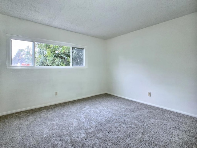 3304 E St, San Diego, CA 92102 - spare room featuring carpet, baseboards, and a textured ceiling