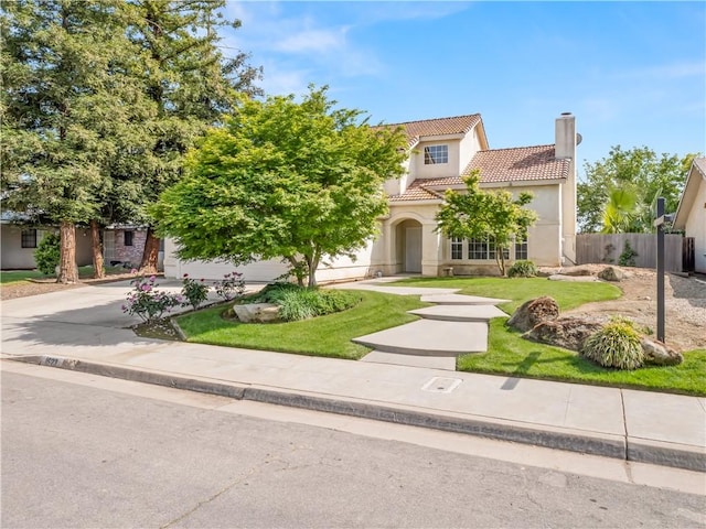 1523 E Pryor Dr, Fresno, CA 93720 - view of front of property featuring a tile roof, stucco siding, a chimney, and driveway
