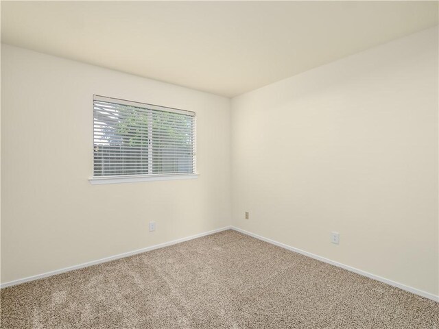 1523 E Pryor Dr, Fresno, CA 93720 - carpeted empty room with baseboards