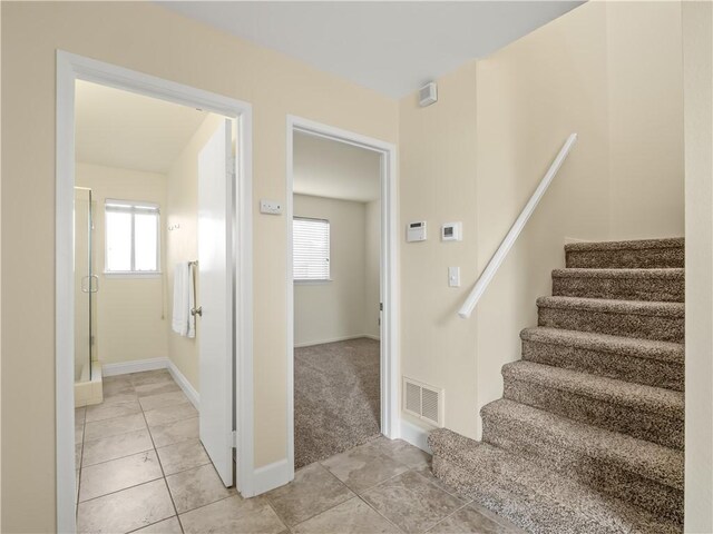 1523 E Pryor Dr, Fresno, CA 93720 - staircase featuring healthy amount of natural light and tile patterned floors