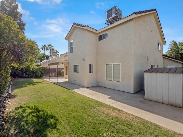 1523 E Pryor Dr, Fresno, CA 93720 - rear view of house featuring a patio area, a storage unit, and stucco siding