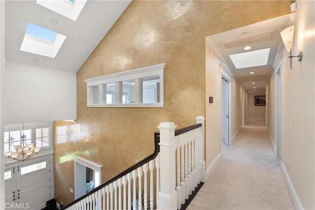 1921 Windward Ln, Newport Beach, CA 92660 - corridor with a skylight, an upstairs landing, carpet flooring, high vaulted ceiling, and baseboards
